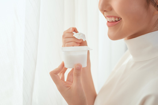 woman eating yogurt