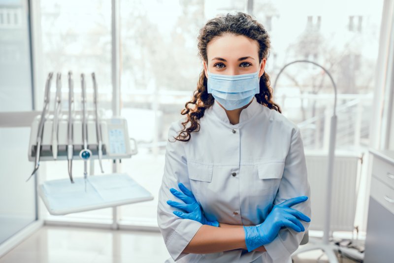 Dentist smiling in a dental office